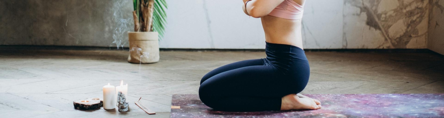 A woman practicing yoga after the addiction treatment because holistic approach and behavioral therapies are the most commonly used forms of drug abuse treatment.