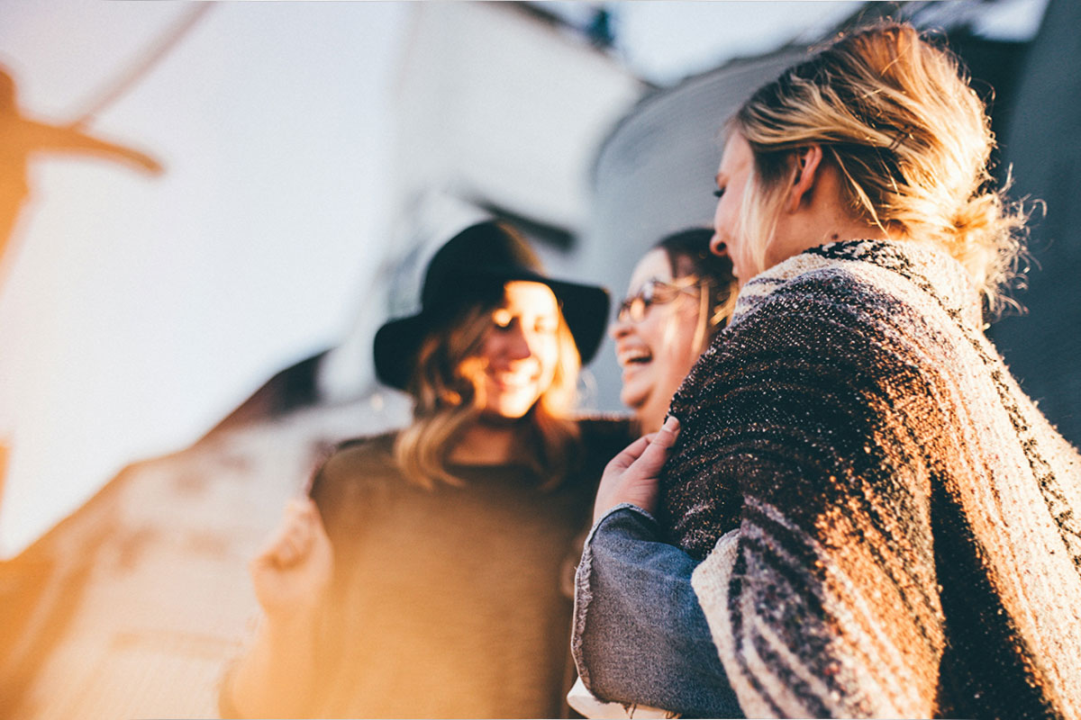 Two girls smiling and wondering - Is Gen Z the Loneliest Generation?